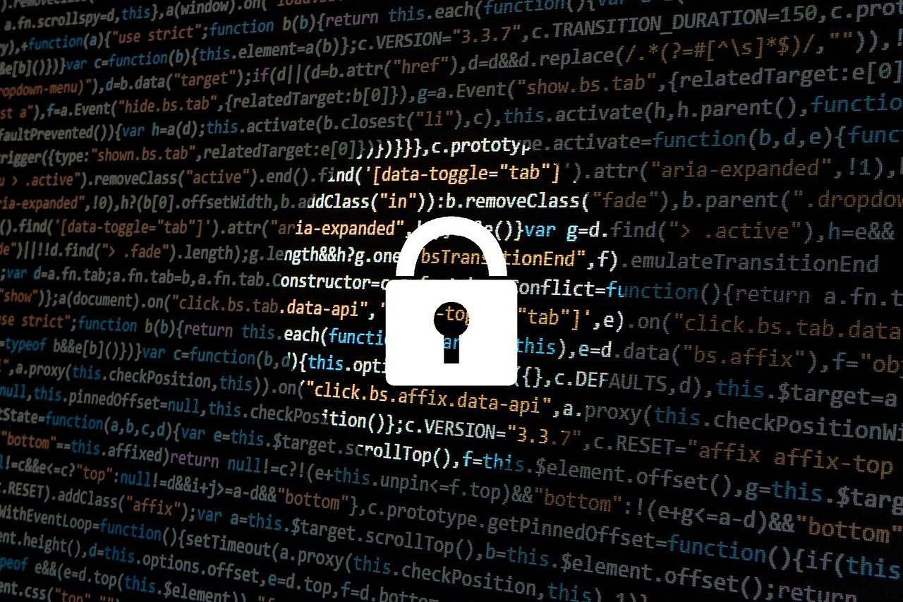 Aug2023#2 A digital lock on a screen full of programmatic code.